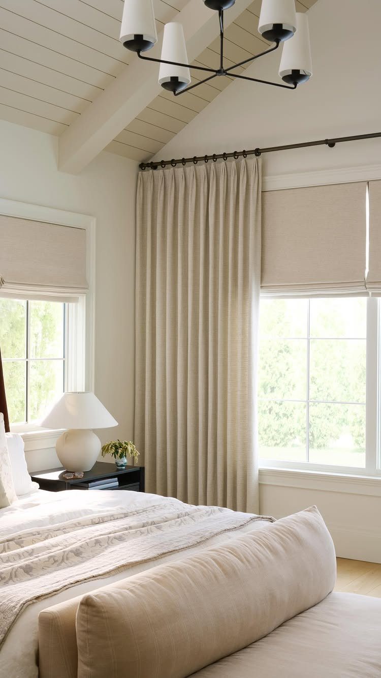Master Bedroom Interior Design: 16 Ideas for a Better Space 11 Beige floor-to-ceiling curtains in a bright master bedroom with a white bed and lamp.