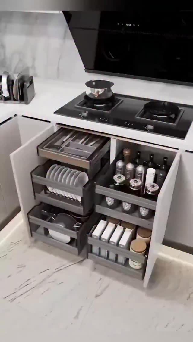32 Simply Kitchen Design Ideas for a Clean, Modern Space 25 Grey pull-out shelves in a white kitchen cabinet holding plates and condiments