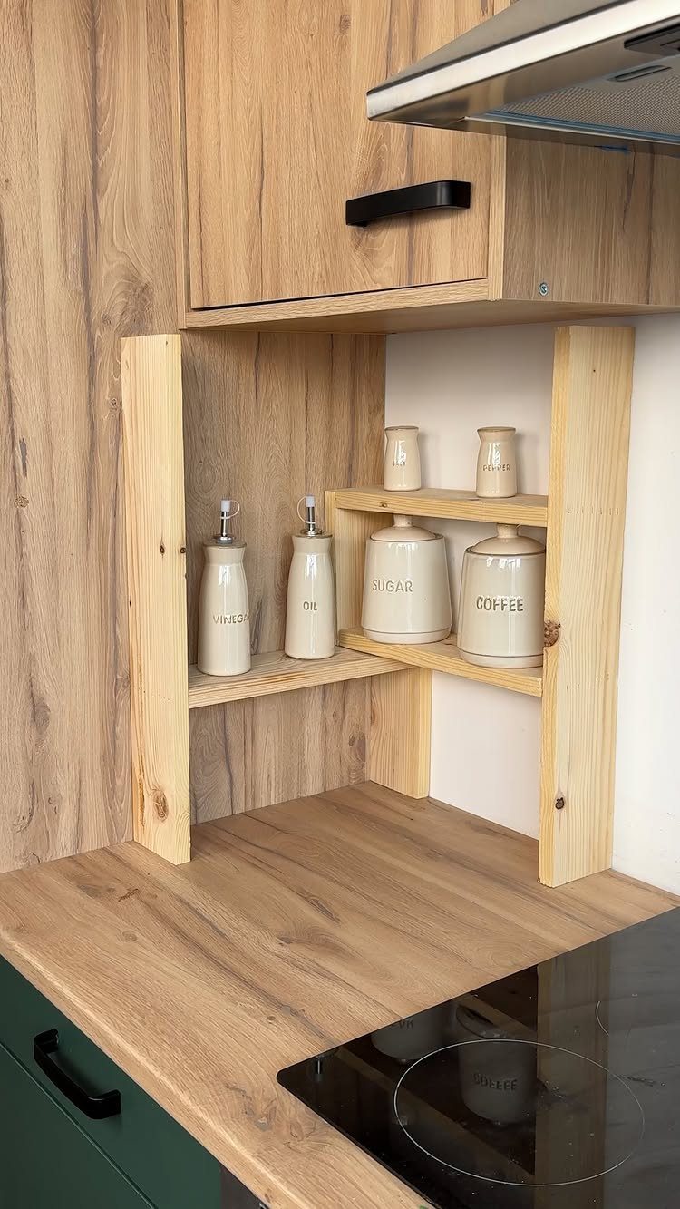 Wooden corner shelf in a kitchen holding ceramic coffee and sugar canisters