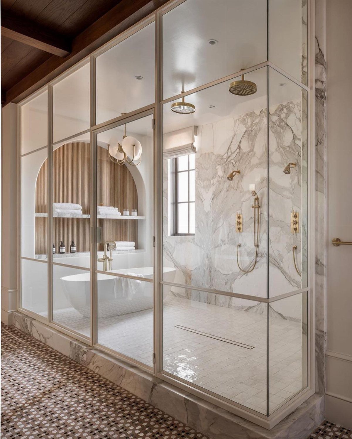 Bathroom Alcove Ideas: 29 Designs for Tubs, Showers & More 11 White freestanding bathtub inside a wooden arched alcove with built-in shelving and marble walls.