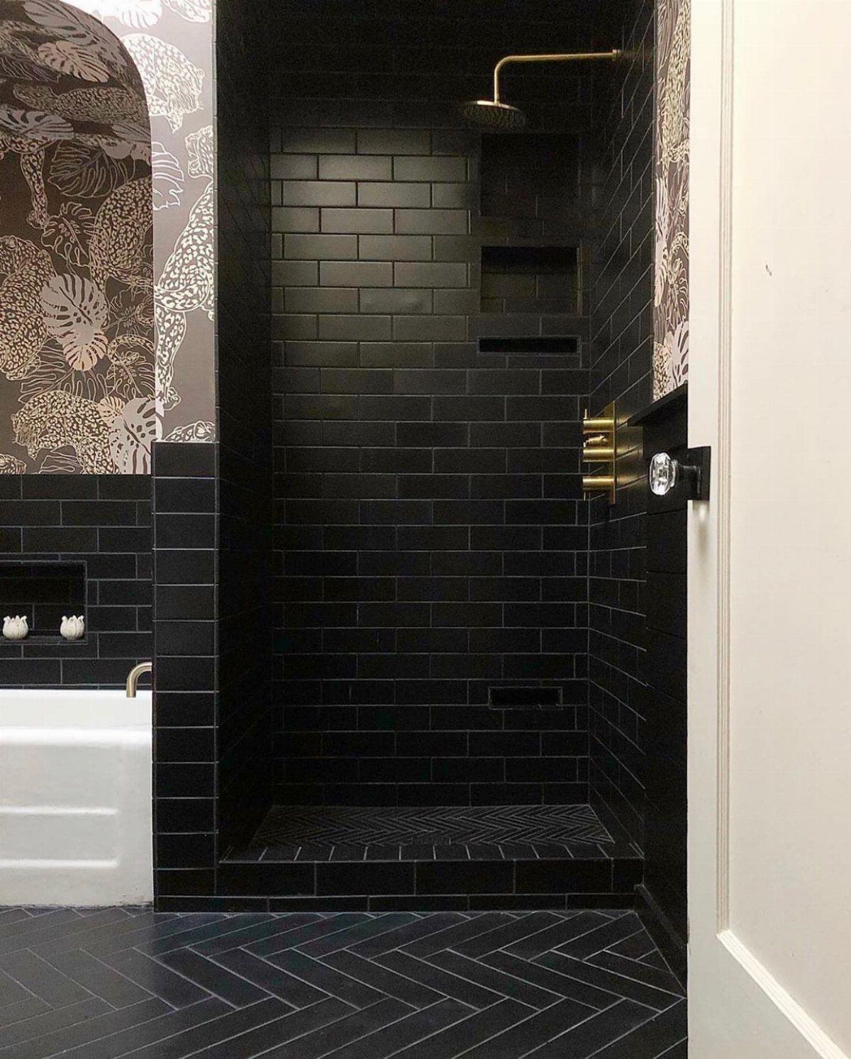 Black Mosaic Tile Bathroom: 14 Designs from Hex to Herringbone 13 Black tiled walk-in shower with gold fixtures and herringbone floor in a modern bathroom
