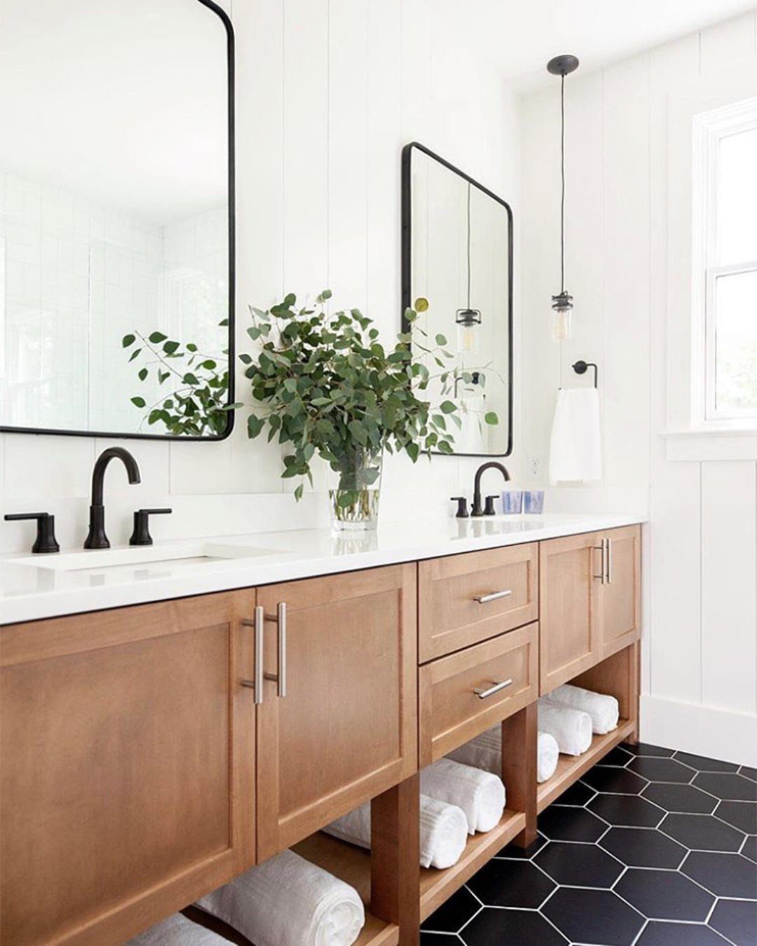 Black Mosaic Tile Bathroom: 14 Designs from Hex to Herringbone 4 Black hexagon mosaic tile floor in a bathroom with a wooden vanity.