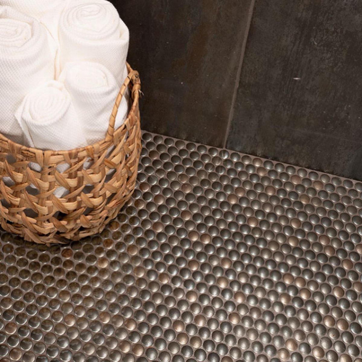Black Mosaic Tile Bathroom: 14 Designs from Hex to Herringbone 7 Black penny round tile floor with a wicker basket of white towels.