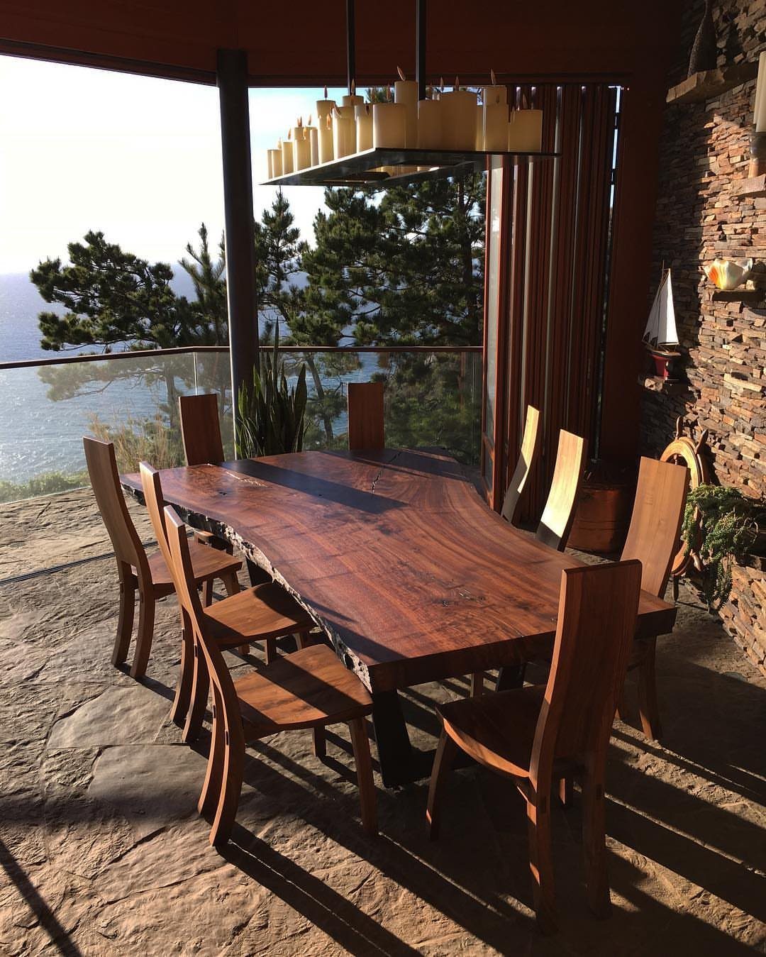 Live Wood Furniture in 31 Styles, from River Tables to Desks 12 Live edge wood dining table with matching chairs on a stone outdoor patio.