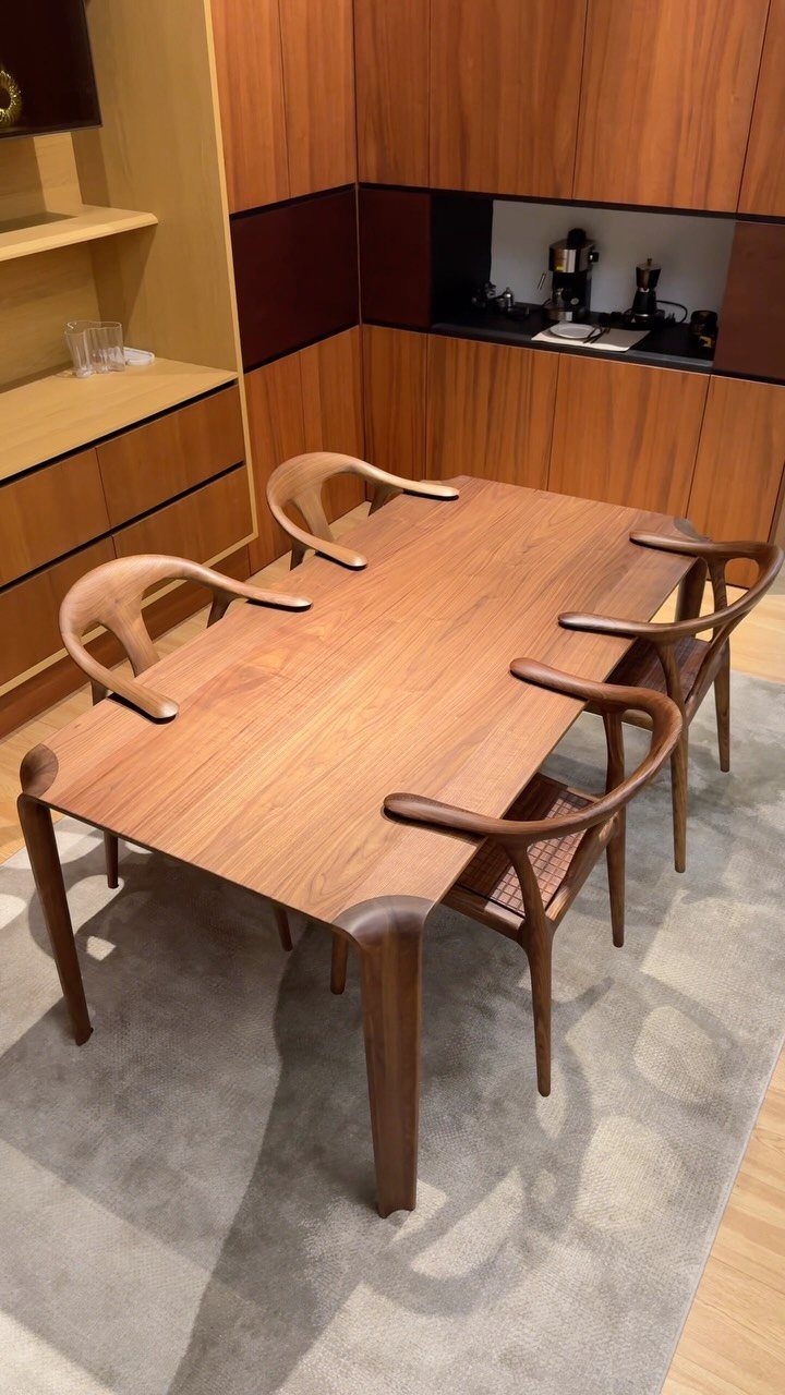 Contemporary Dining Sets in 12 Styles for Your Space 4 Rectangular wooden dining table with four matching curved armchairs on a grey rug.