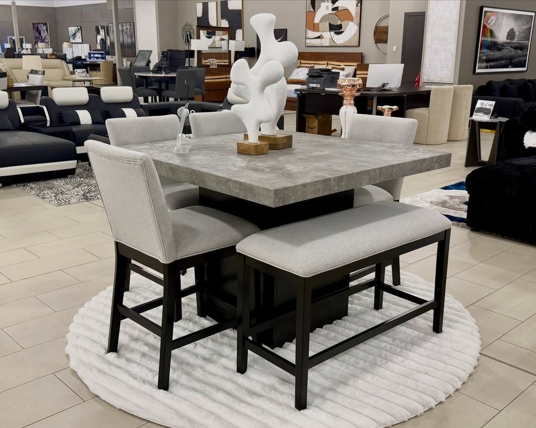 Contemporary Dining Sets in 12 Styles for Your Space 11 Grey concrete counter-height dining table with matching upholstered chairs and bench on white rug.