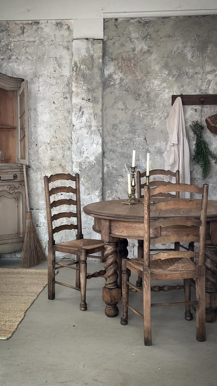 20 French Farmhouse Dining Table Ideas for Every Style 8 Round rustic wooden dining table with spiral legs and matching ladder-back chairs.