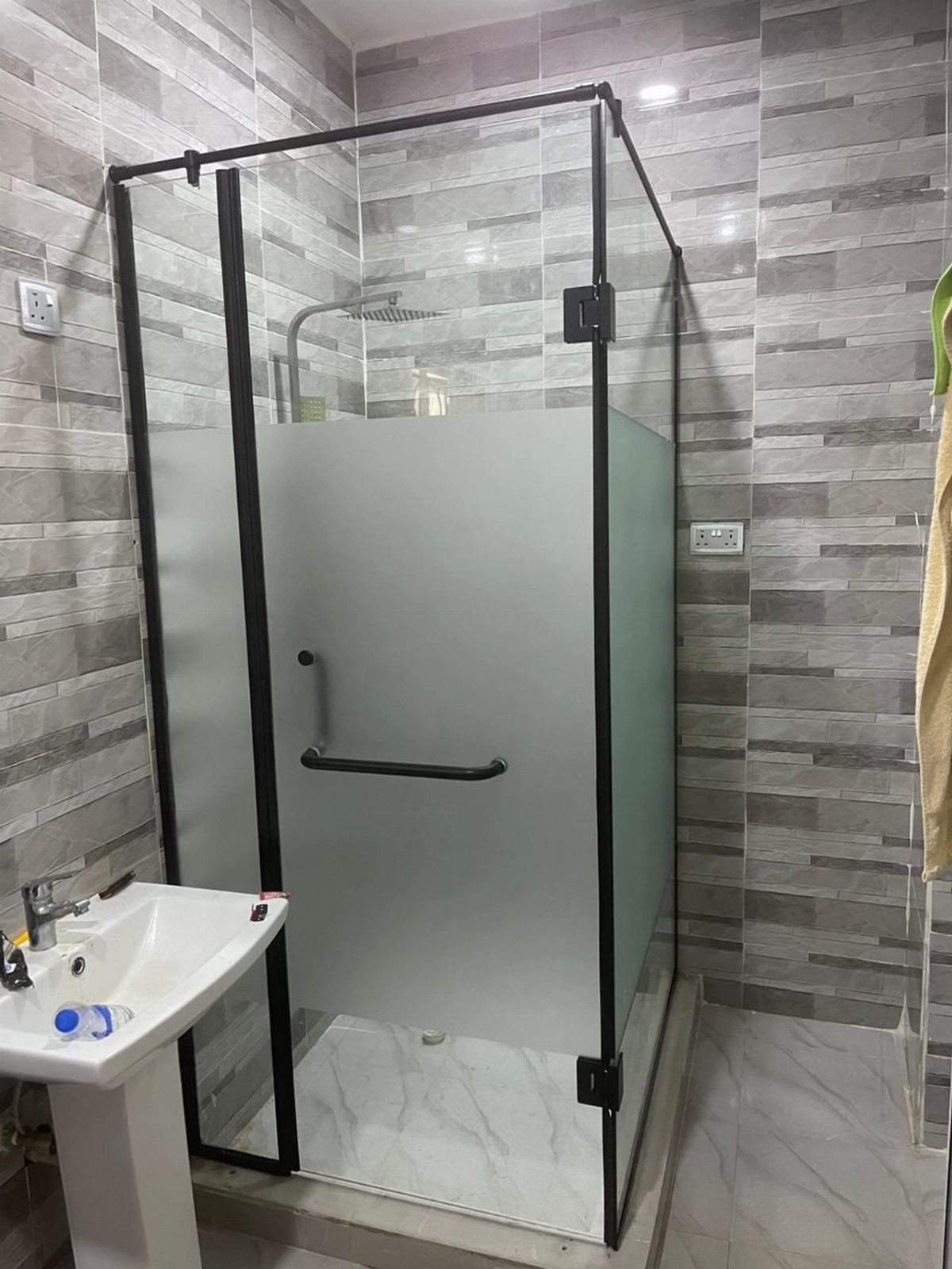 Bathroom Alcove Ideas: 29 Designs for Tubs, Showers & More 18 Shower enclosure with frosted glass panels and black frames in a tiled bathroom.