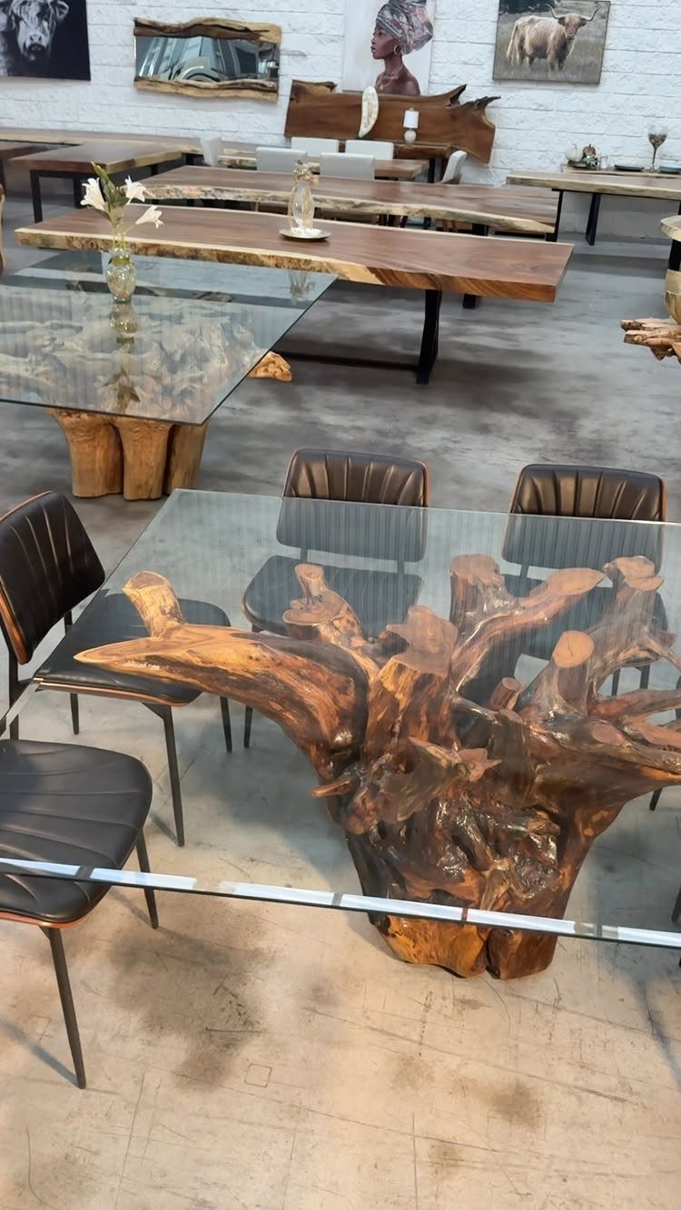 Live Wood Furniture in 31 Styles, from River Tables to Desks 27 Glass-topped dining table with a natural wood root base and black chairs