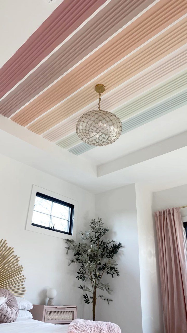 Master Bedroom Interior Design: 16 Ideas for a Better Space 4 Striped colorful ceiling in pink and mint tones with a gold pendant light.