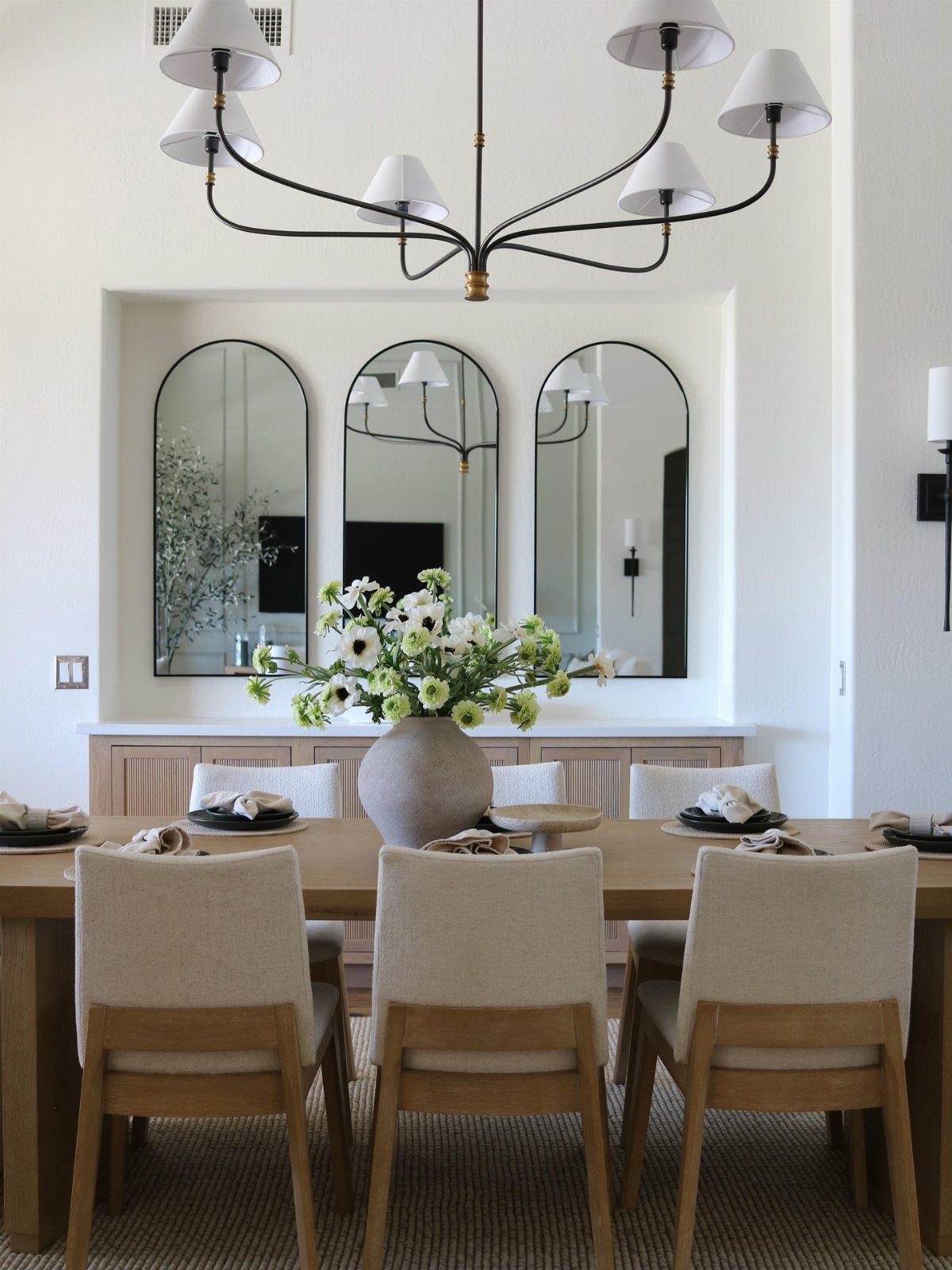 Contemporary Dining Sets in 12 Styles for Your Space 3 Rectangular wooden dining table with beige upholstered chairs and a floral centerpiece.