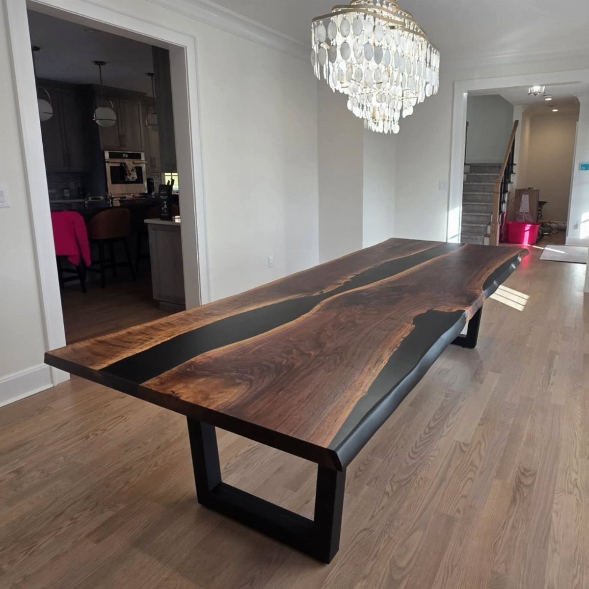 Live Wood Furniture in 31 Styles, from River Tables to Desks 7 Live edge dining table with a black resin river and black metal legs.