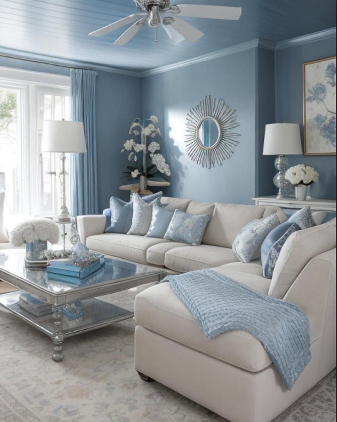 12 Blue White Living Room Ideas with Photos and Styling Tips 8 Bright living room with blue walls, cream sectional, and natural light from windows.