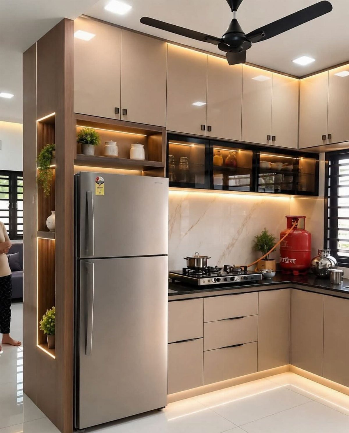 27 Small Kitchen with Fridge Ideas That Maximize Every Inch 26 Modern small kitchen with beige cabinetry, silver refrigerator, and black countertops.