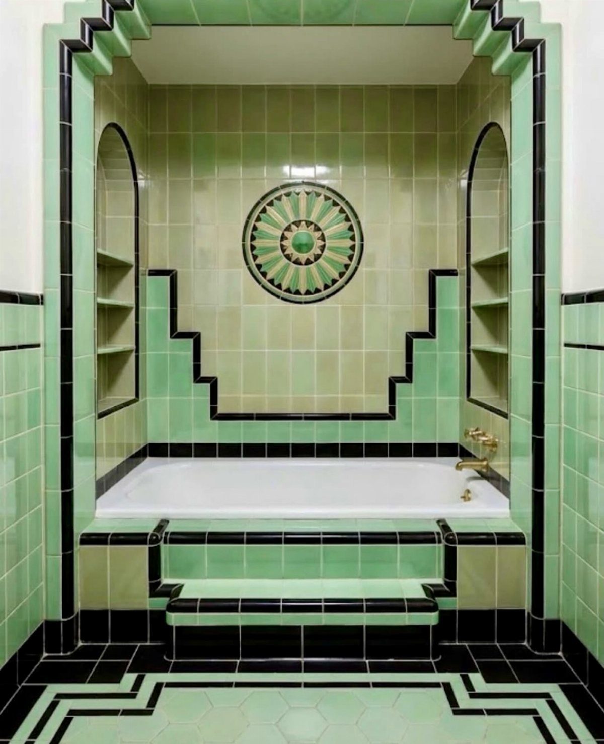 Bathroom Alcove Ideas: 29 Designs for Tubs, Showers & More 28 White bathtub in a green tiled alcove with black trim and decorative medallion.