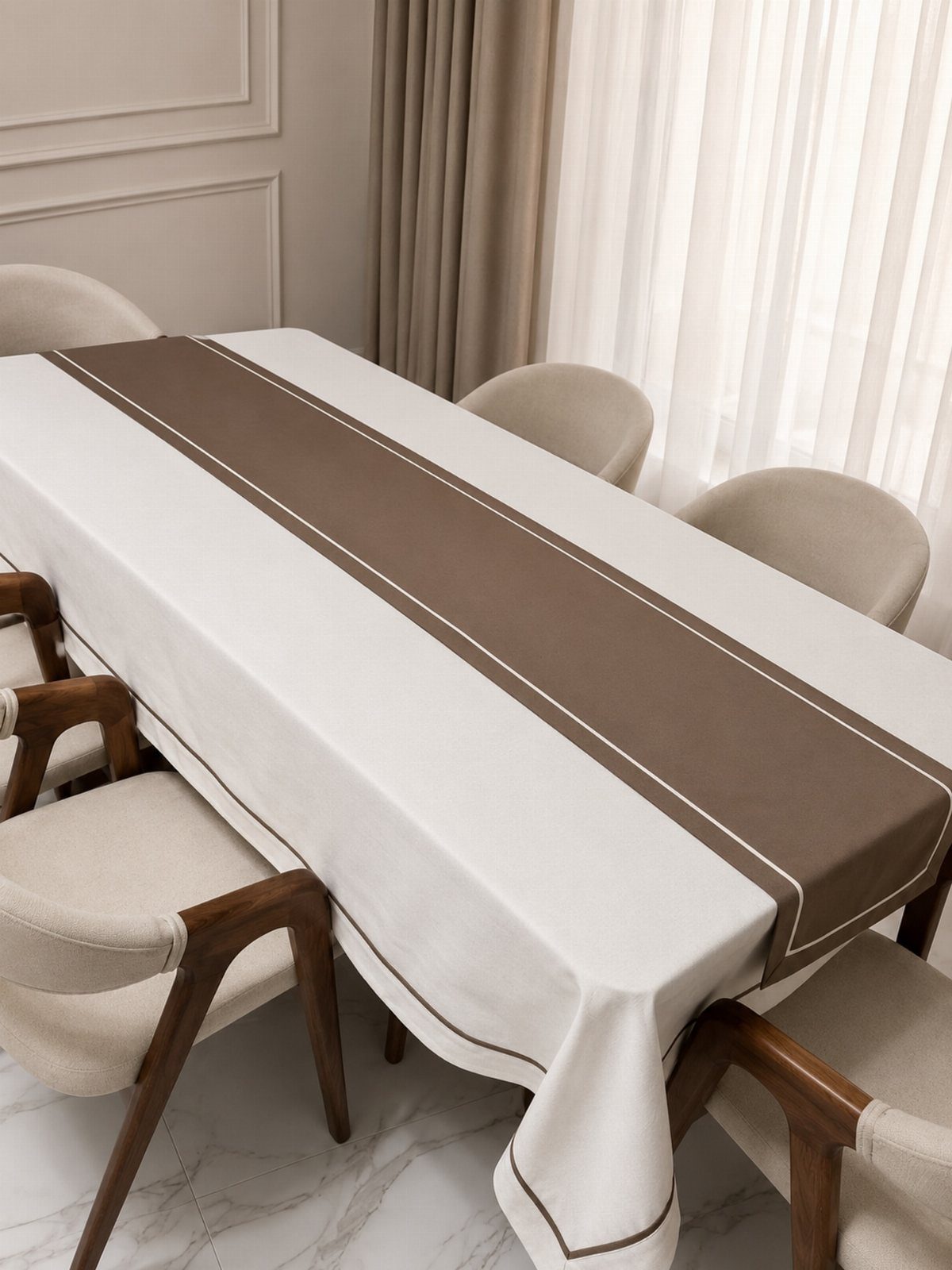 White rectangular tablecloth with a brown table runner on a dining table.