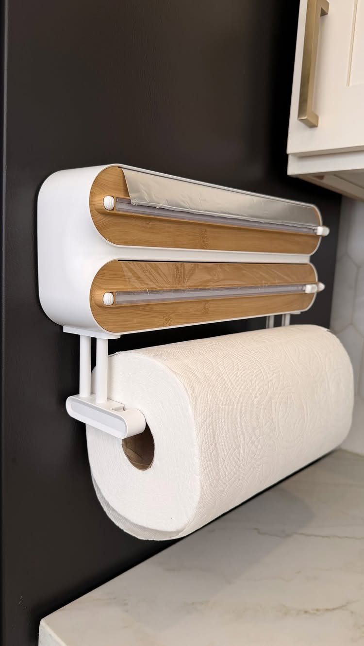 Small Kitchen Essentials: 13 Tools That Actually Matter 14 Paper towel holder with wooden shelves mounted on a black kitchen wall.