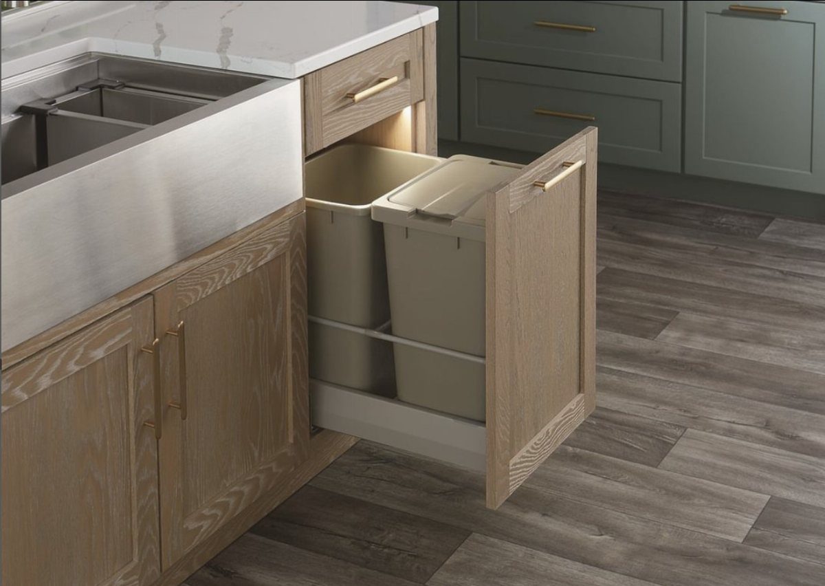 26 Pull Out Drawer Kitchen Ideas That Save Space 2 Pull-out kitchen cabinet drawer containing two beige plastic waste and recycling bins.