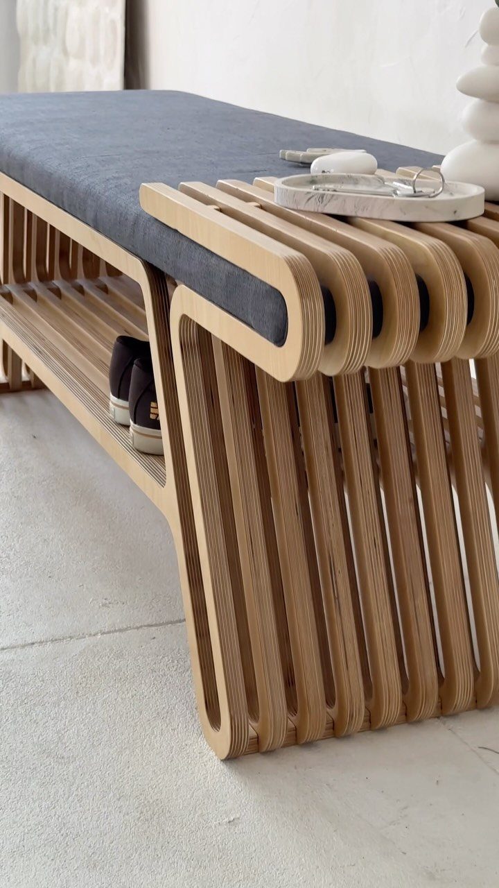 Wood Art Furniture: 31 Ideas From Rustic to Sculptural Forms 6 Modern wooden bench with curved plywood slats and a dark grey seat cushion.